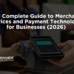A customer’s hand holding a smartphone over a contactless payment terminal at a checkout counter, with a cashier in a brown apron in the background. Bold white text overlays the scene reading "The Complete Guide to Merchant Services and Payment Technology for Businesses (2026)" alongside the Nationwide Payment Systems logo.