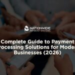 A close-up view of multiple people standing in a circle, focused on using their smartphones. White text overlays the center reading "Complete Guide to Payment Processing Solutions for Modern Businesses (2026)," with the white Nationwide Payment Systems logo positioned directly above it.