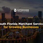 An aerial drone photograph capturing the downtown Miami and Brickell skyline at twilight, featuring illuminated skyscrapers along Biscayne Bay under a dramatic evening sky. Bold white and yellow text overlays the center reading "South Florida Merchant Services for Growing Businesses," with the Nationwide Payment Systems logo placed prominently at the top center.