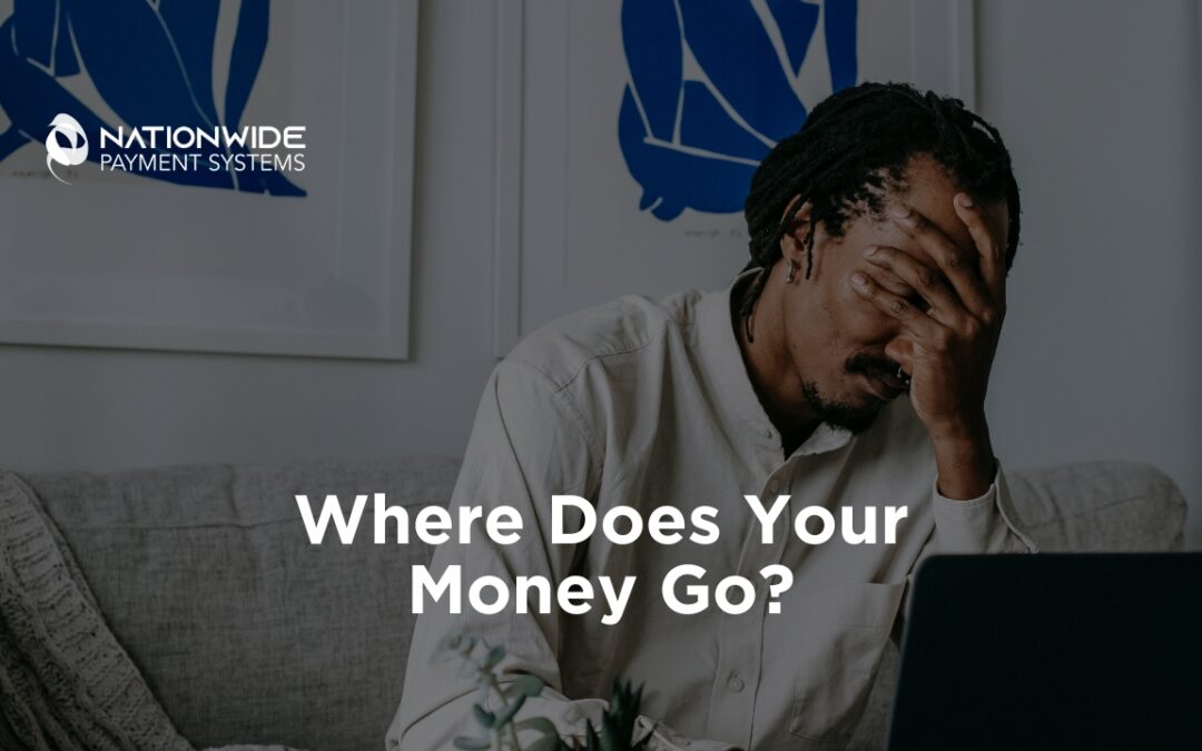 An image of a man looking highly stressed and frustrated, covering his face with his hand while sitting in front of an open laptop on a sofa. Text overlays the bottom center reading "Where Does Your Money Go?" with the Nationwide Payment Systems logo visible in the top left corner.