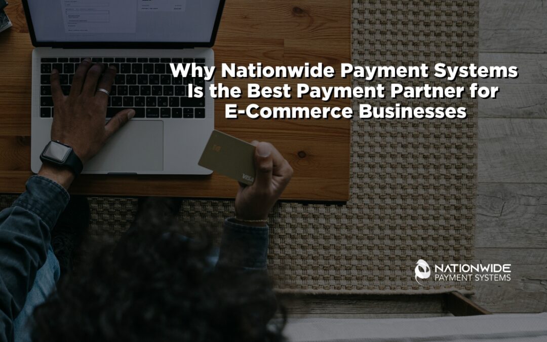 An overhead, bird's-eye view of an entrepreneur sitting at a wooden desk on a woven rug, working on a silver laptop. One hand rests on the laptop keyboard while the other holds a gold Visa credit card, preparing to input payment details. Bold white text overlays the center reading "Why Nationwide Payment Systems Is the Best Payment Partner for E-Commerce Businesses," with the white corporate logo positioned in the lower right corner.