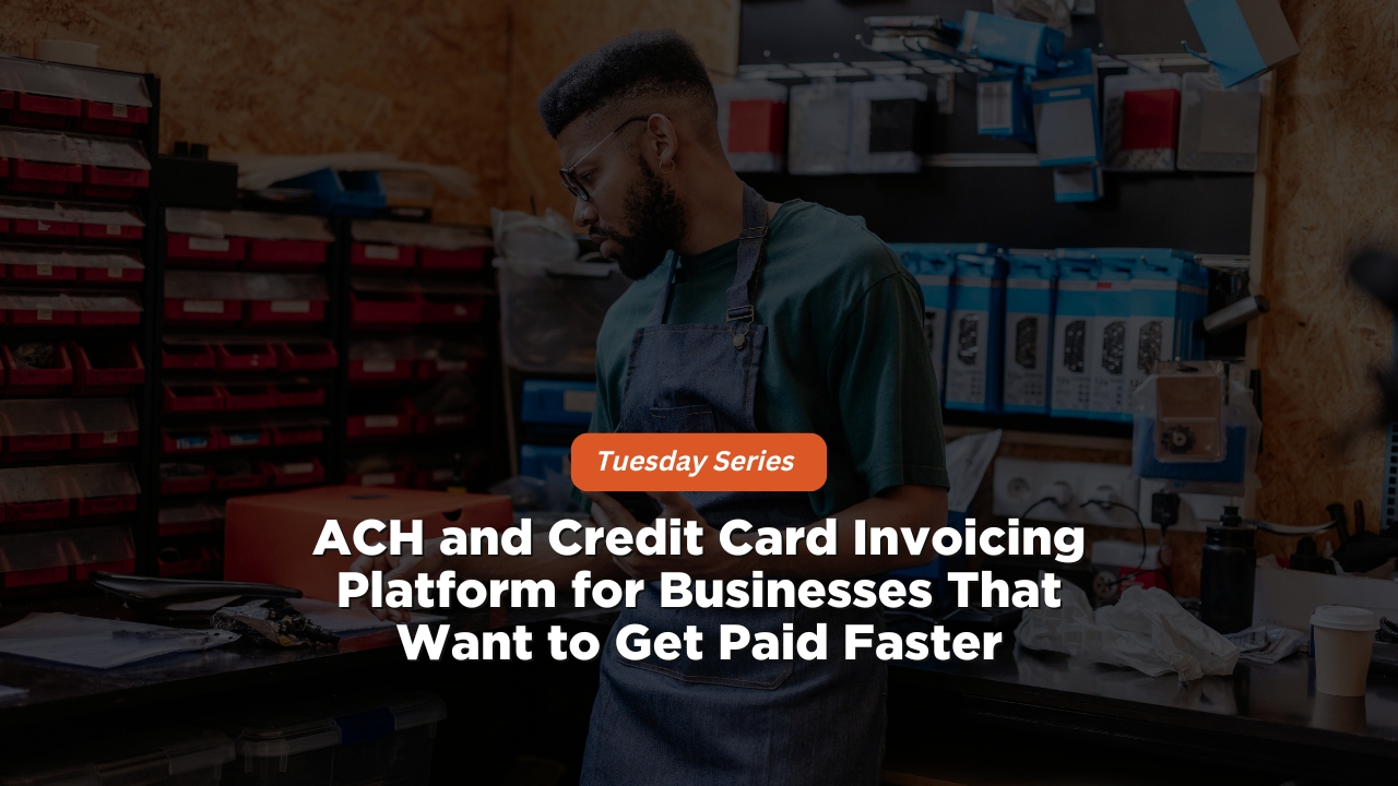 A dark-toned photograph of a tradesperson or workshop owner wearing glasses and a denim apron standing behind a workbench filled with organized hardware storage bins, tools, and equipment. Positioned near the center is a bright orange rounded badge reading "Tuesday Series" above bold white text that reads: "ACH and Credit Card Invoicing Platform for Businesses That Want to Get Paid Faster".