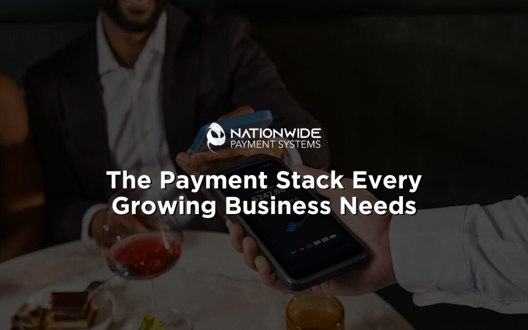A close-up photograph of a server holding out a modern, dark hand-held smart POS payment terminal. A customer in a dark suit jacket holding a blue smartphone hovers their device over the screen to complete a contactless NFC mobile wallet transaction [cite: The Payment Stack Every Growing Business Needs (1).jpg]. In the background, a dining table features a glass of red wine, a desert plate, and a warm-colored drink [cite: The Payment Stack Every Growing Business Needs (1).jpg]. Centered in the middle of the image is the white Nationwide Payment Systems logo above bold white overlay text that reads: "The Payment Stack Every Growing Business Needs"